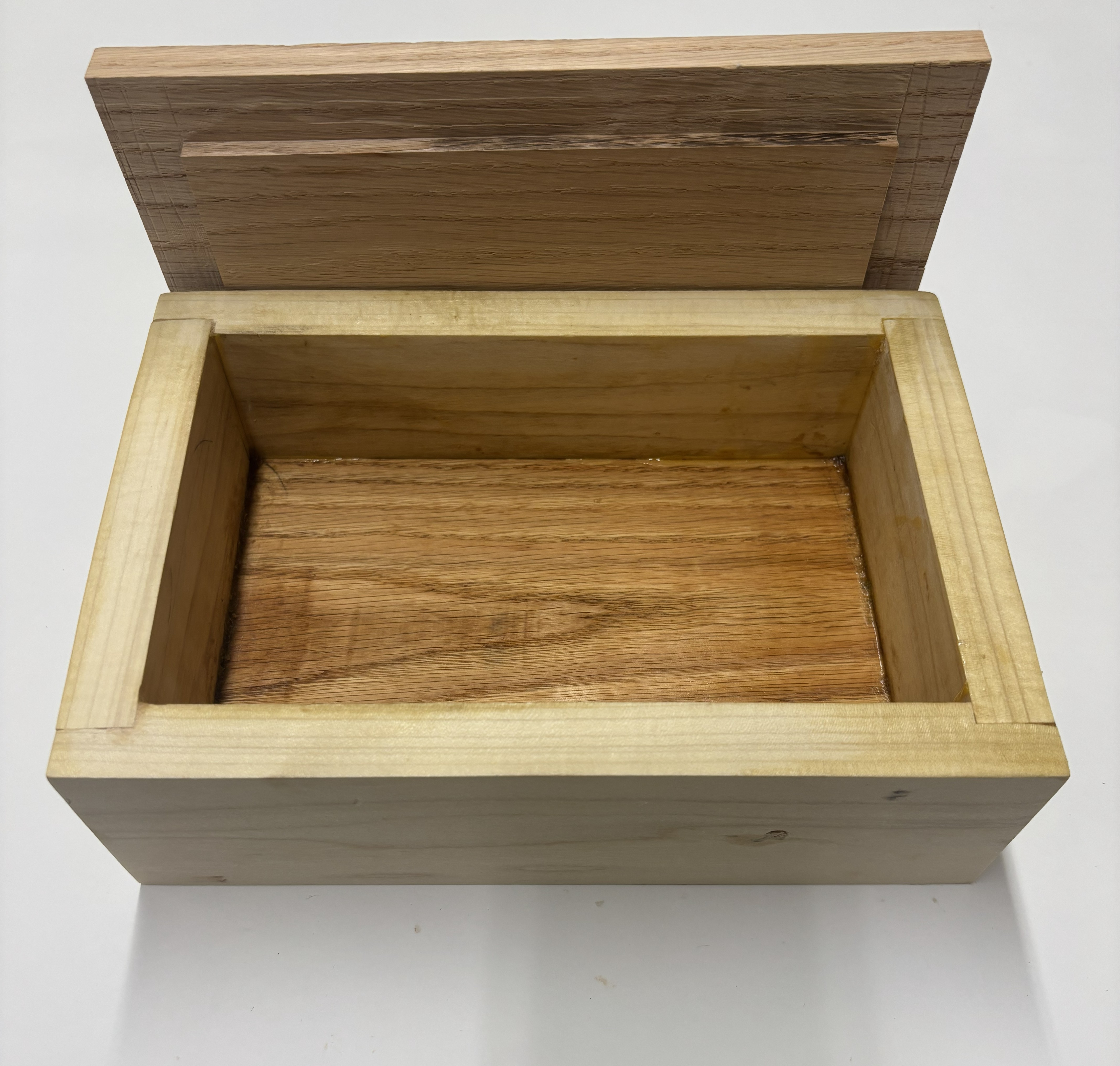 Student woodworking: wood box open, interior joinery