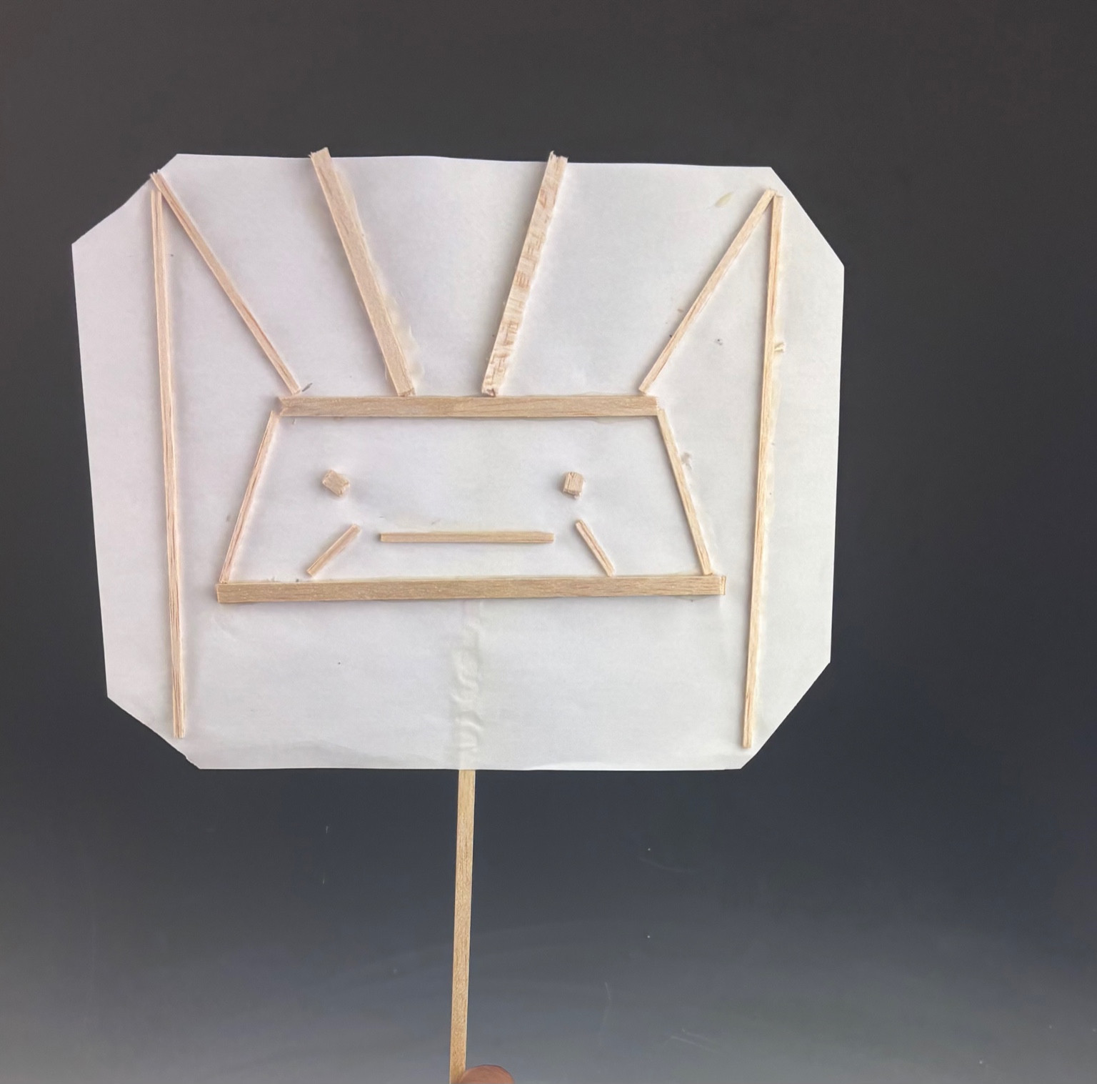 Student 3D: robot face relief, balsa sticks on vellum